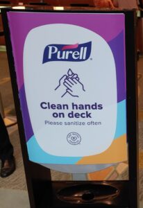 Hand sanitizer station sign on Allure of the Seas