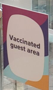 COVID-19 Vaccinated Guest Area sign on Allure of the Seas